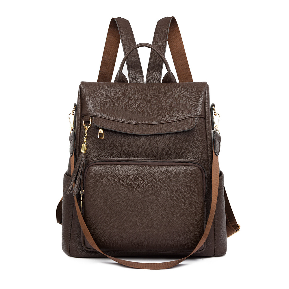 2024 nuevas damas casuales de cuero suave mochila antirrobo moda borla color de contraste mochila de viaje de gran capacidad al por mayor