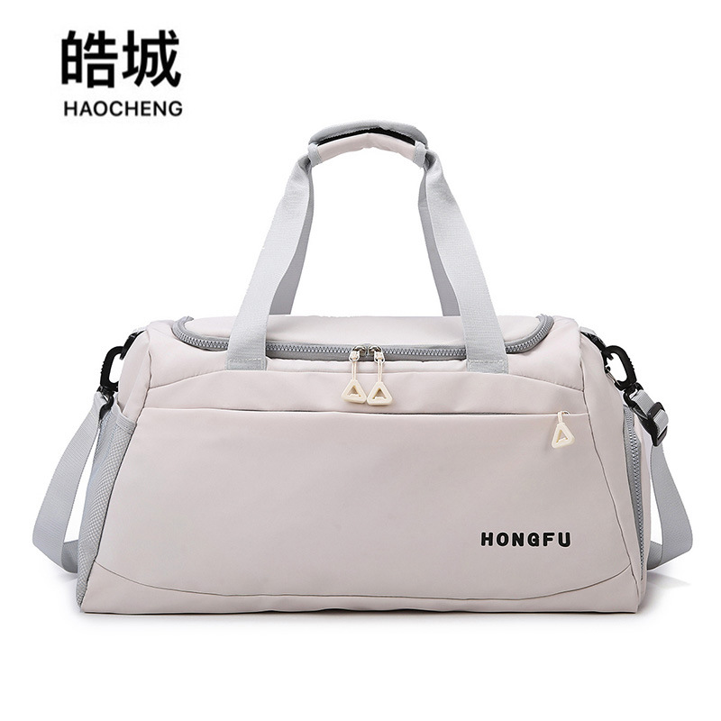 Nueva bolsa de viaje portátil transfronteriza, bolsa de almacenamiento de equipaje de viaje de viaje de corta distancia, bolsa de yoga de entrenamiento deportivo para mujer