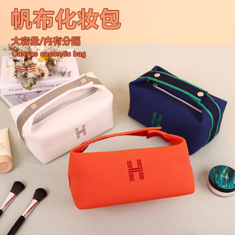 Bolsa de cosméticos de lona impermeable portátil de alta apariencia de gran capacidad de lavado bolsa de cosméticos de red roja portátil bolsa de almacenamiento de color sólido