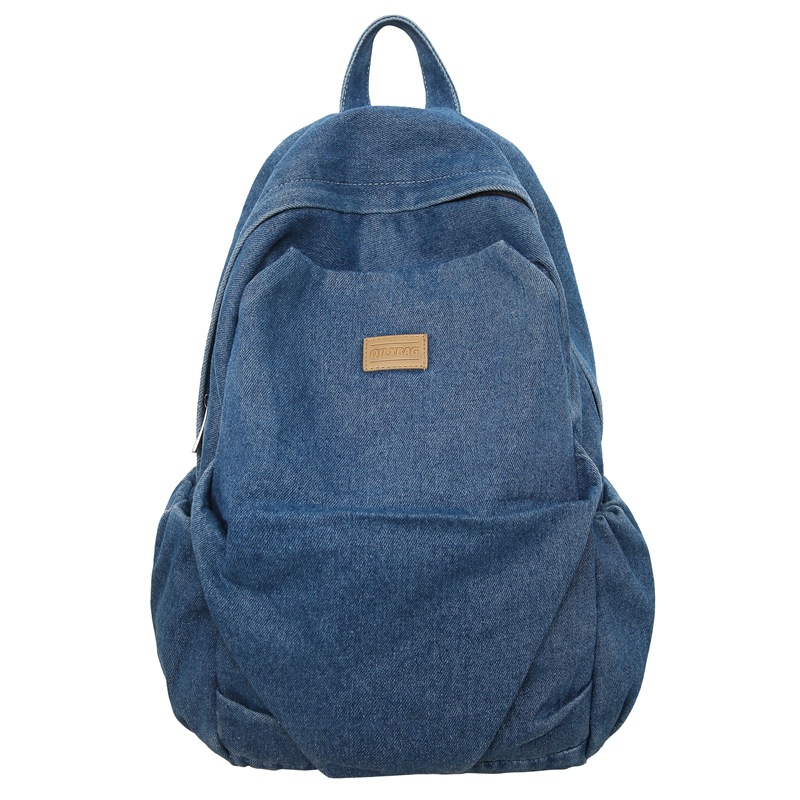 Mochila de mezclilla de gran capacidad para estudiantes de secundaria para mujeres, bolsa de viaje ligera, mochila de ocio estilo de Hong Kong, mochila al por mayor