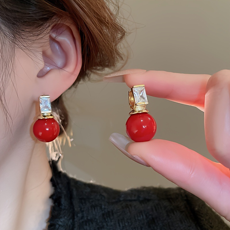 Pendientes de amor con goteo de aceite rojo con aguja de plata, botones de oreja de temperamento de moda de nicho, pendientes simples y de alta gama de estilo de Hong Kong