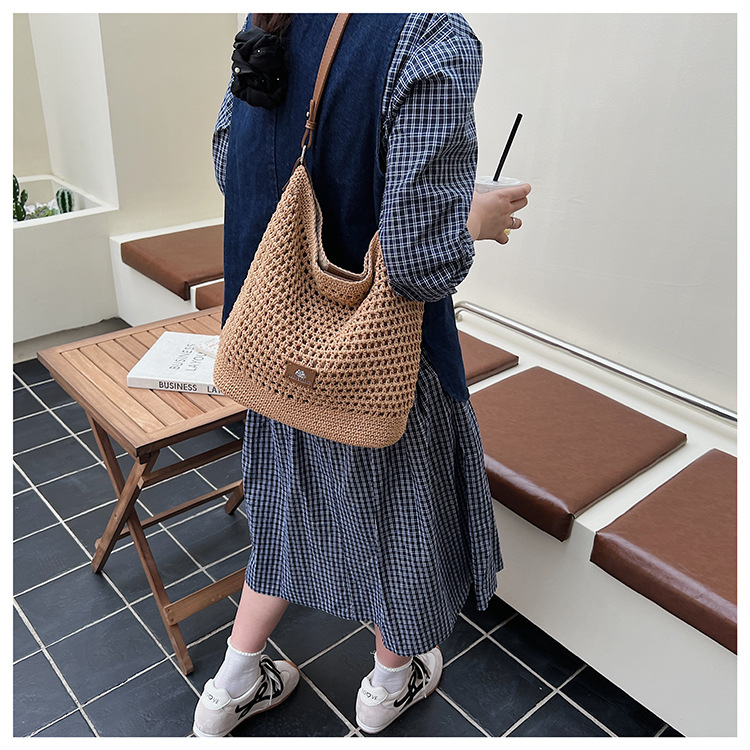 Summer hollowed-out knitted underarm bag for women, 2025 new style, laid-back and relaxed, seaside vacation style single-shoulder crossbody bag undefined