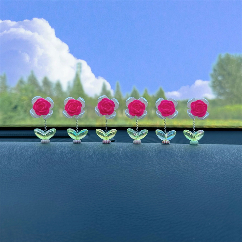 Tendencia nuevo producto flocado rosa coche sacudiendo la cabeza pequeños adornos decoración de primavera tablero accesorios de coche ventana