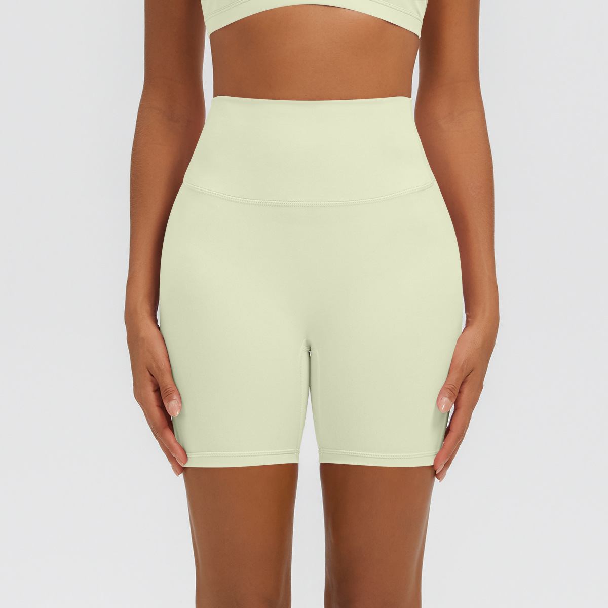 Nuevo tipo delgado de hielo, piel transpirable, ajustado, color sólido, ropa de yoga, pantalones cortos de tres puntos.