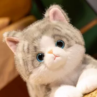 Мягкая игрушка лежащий котёнок реалистичный