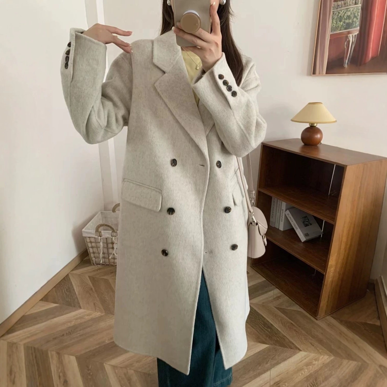 Korean-style double-breasted long over-the-knee wool coat with suit collar, exuding a high-end autumn/winter feel.