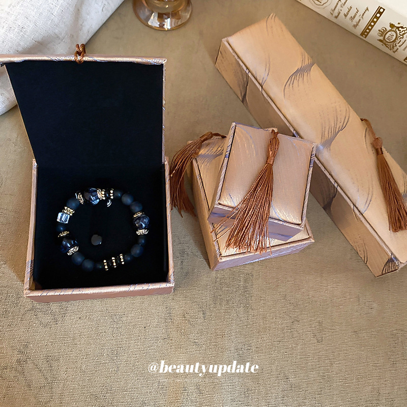 Joyería pluma borla anillo COLLAR COLGANTE pulsera caja de joyería Corea del Sur simple caja de polvo caja portátil