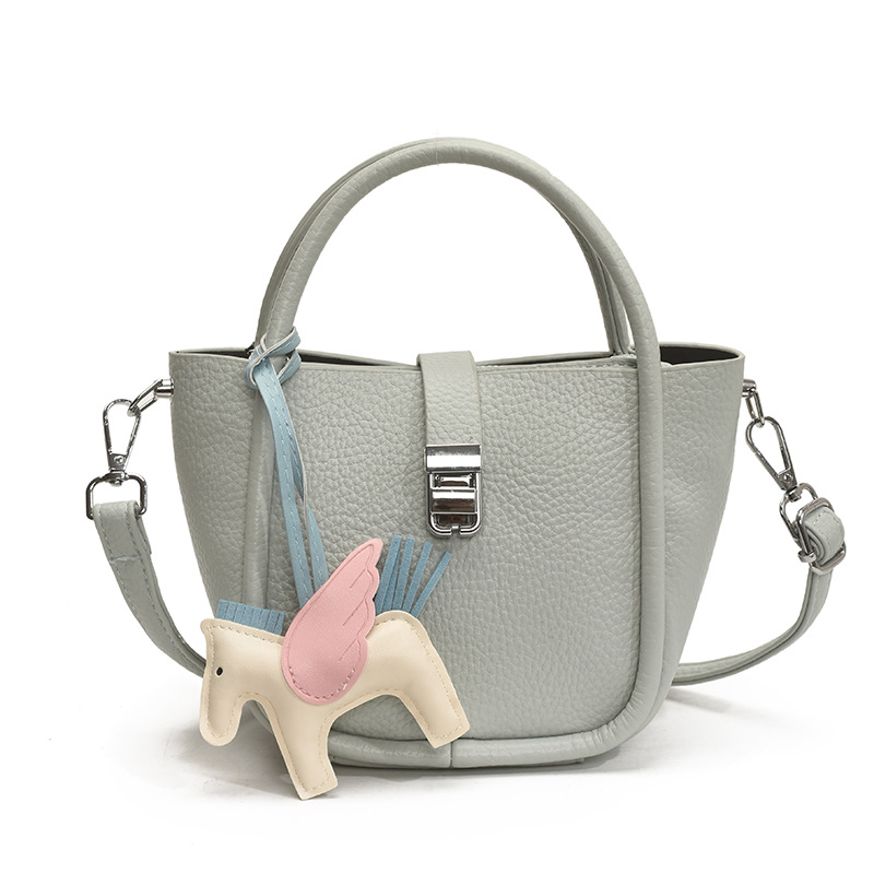 Bolso de cubo para mujer, tendencia transfronteriza de alta gama, bolso de mano con patrón de lichi, viaje diario, bolsa de mensajero de canasta de verduras de estilo occidental
