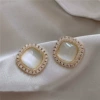 Golden square ear clips, cat's eye