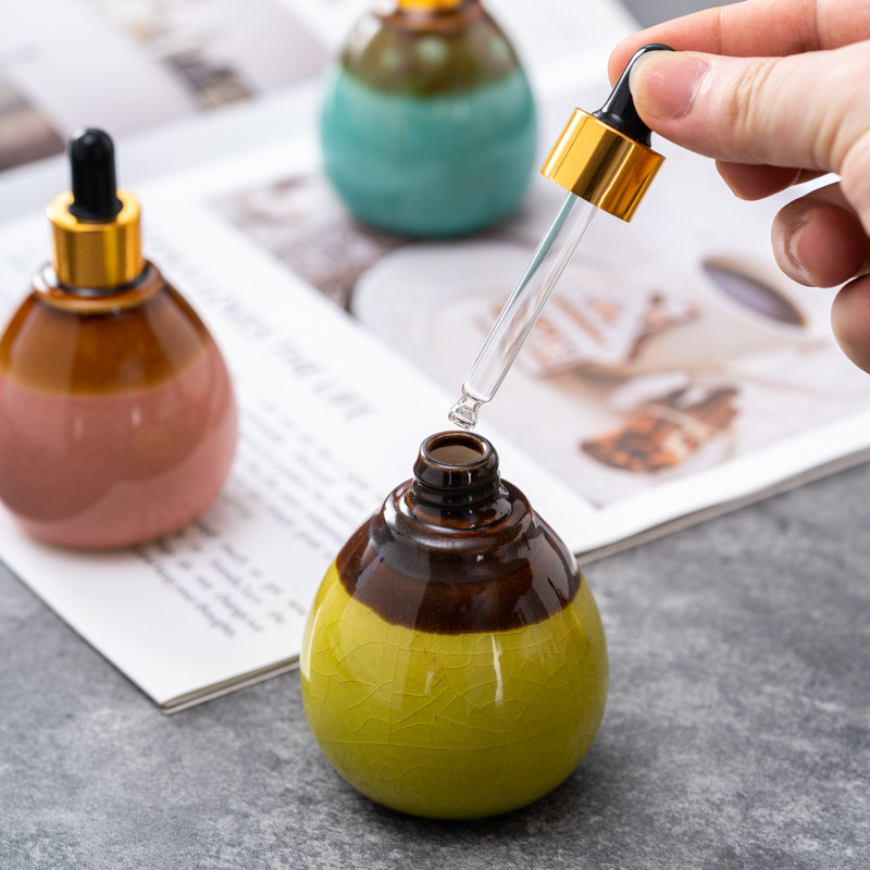 Cuentagotas de vidrio de alta calidad Esencia de aceite esencial de cerámica Cuidado de la piel botella salón de belleza spa tailandés aromaterapia spa botella de despliegue