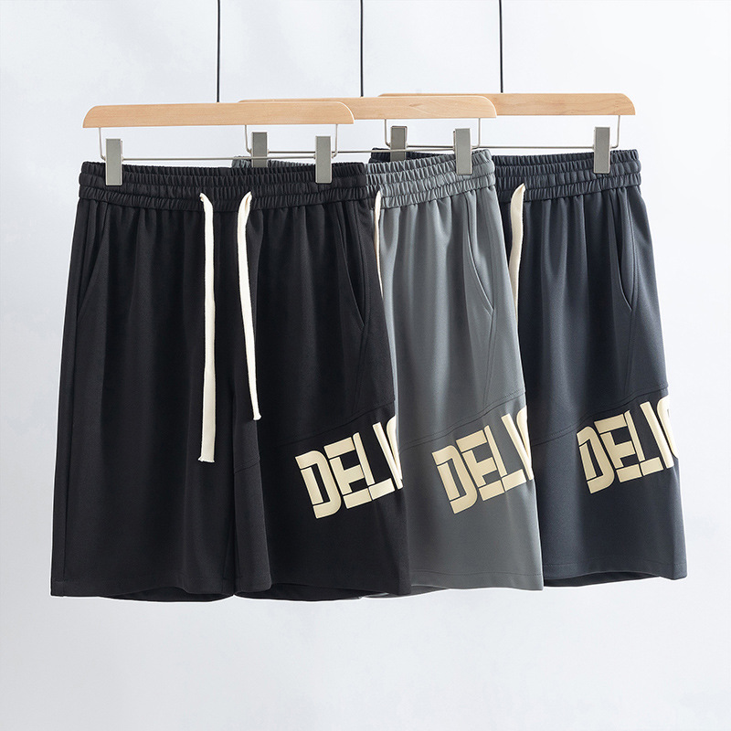 Pantalones deportivos casuales para hombres de verano nuevos pantalones de cinco puntos de estilo de Hong Kong letras sueltas pantalones de impresión de moda pantalones cortos