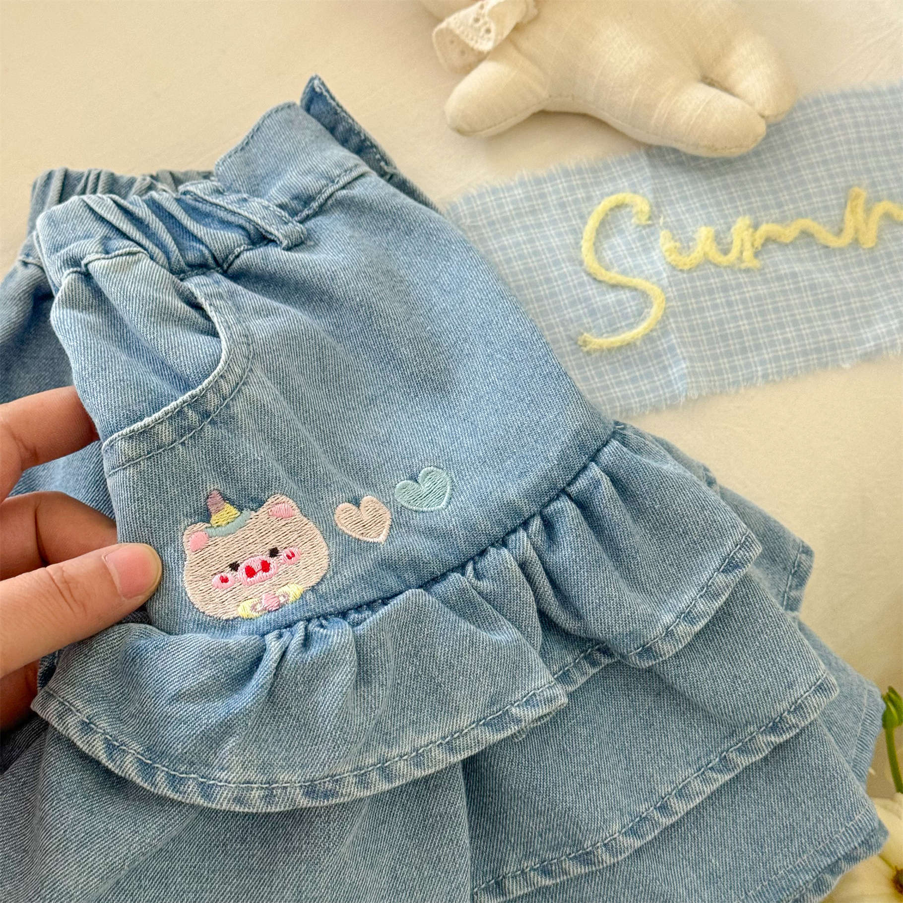 Falda de mezclilla de siete niñas de limón salado, estilo fino de verano de cinco puntos, nuevo estilo, bebé, ropa exterior, falda caliente para niños