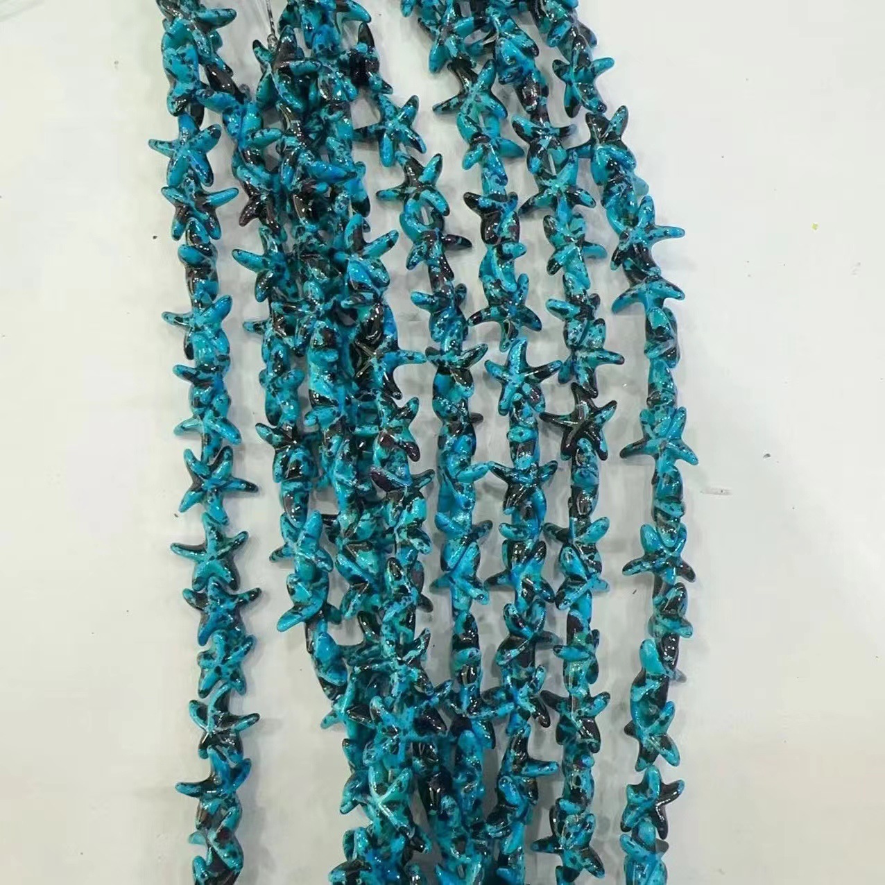 Ventas transfronterizas de coloridas estrellas de mar de piedra de pino cuentas semiacabadas DIY accesorios accesorios materiales de joyería hecha a mano