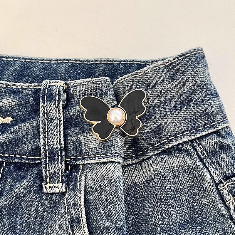 Botón de cintura de mariposa alta sensación jeans ajuste de cintura de botón fijo pantalones más grandes para reducir el pasador de hebilla sin costura