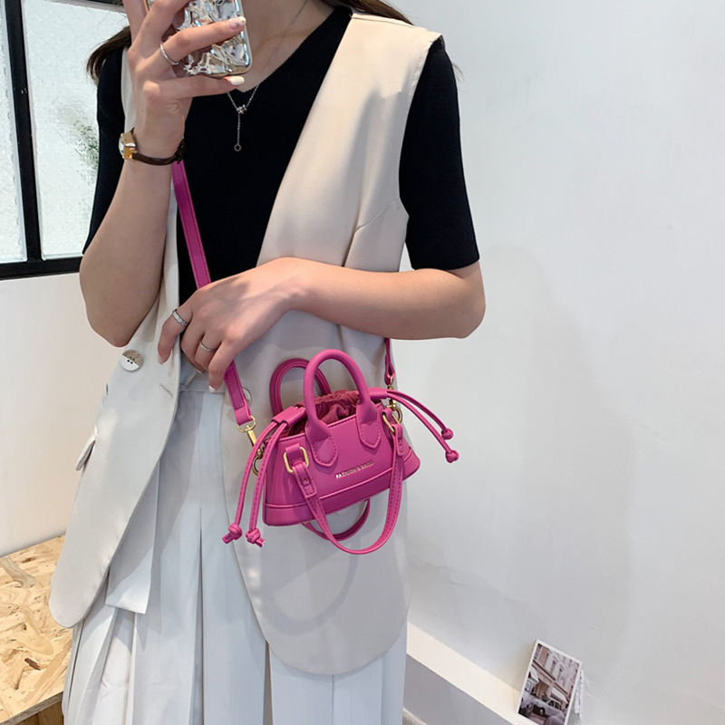 2022 Otoño e Invierno Nueva textura de los niños bolso de mano de moda europea y americana mini bolso de la cáscara transfronteriza bolsa de las mujeres