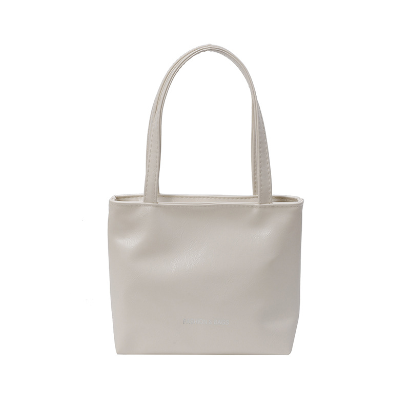 Casual coreano textura simple versátil bolso de viaje de mano de verano 2025 nuevo nicho de diseño de bolso de cubo de mano