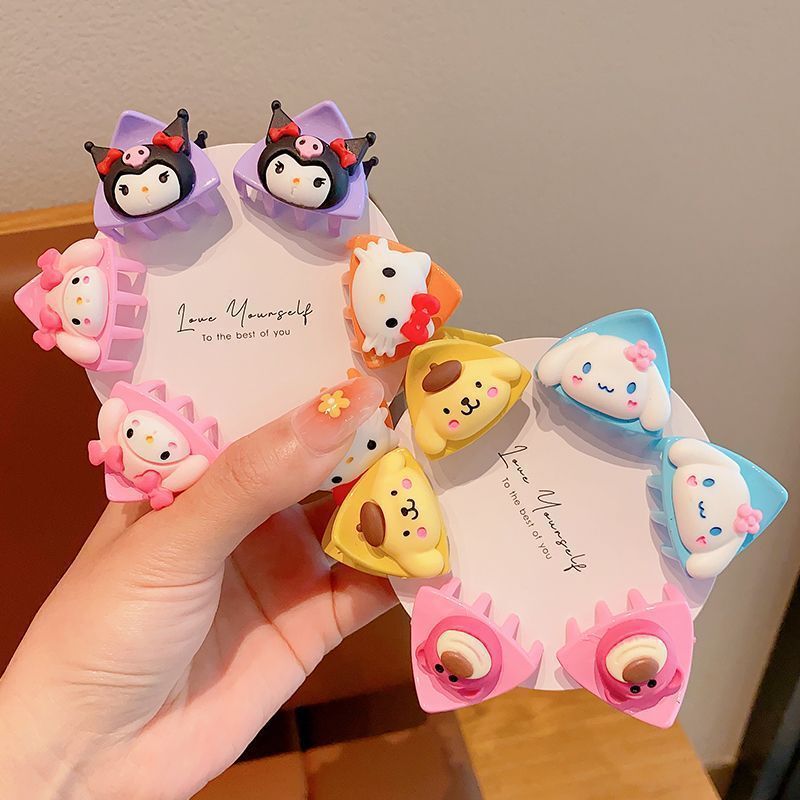かわいい漫画の小さいつかみの子供の砕毛のヘアピンの甘い赤ちゃんのサイドは猫の耳のヘアピンの形のトップを挟みます。|undefined