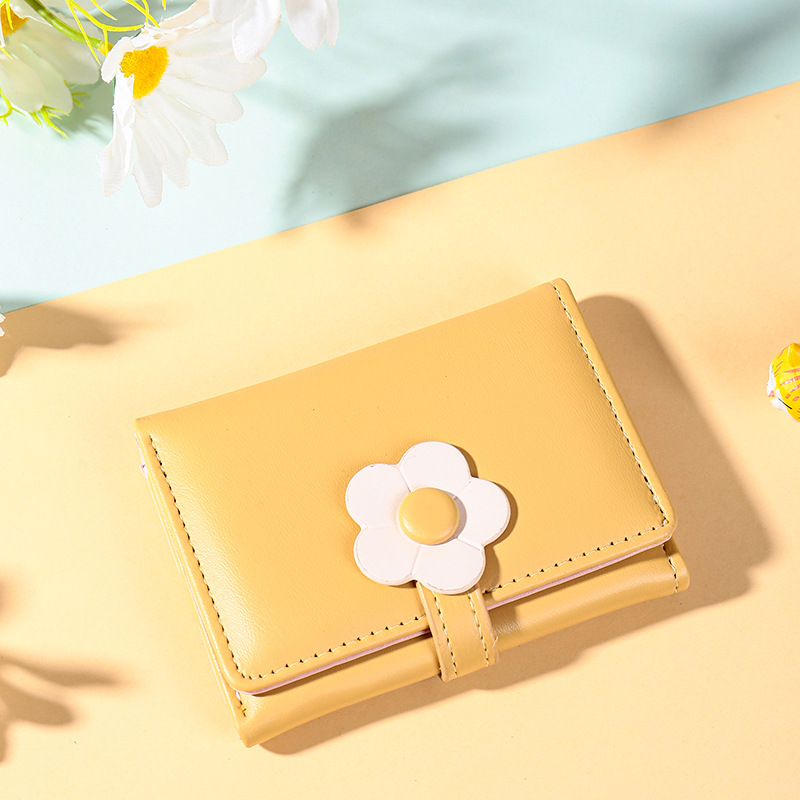 Nuevo estilo coreano de moda simple corto tres plegado billetera de mujer ins tendencia multi-tarjeta adorable pequeña flor pu cartera