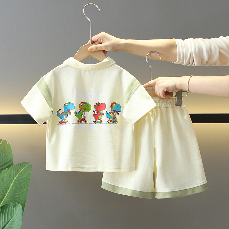7856 traje de verano para niños 2025 nuevo traje de dos piezas de manga corta de dinosaurio para niños ropa de polo de verano para bebés