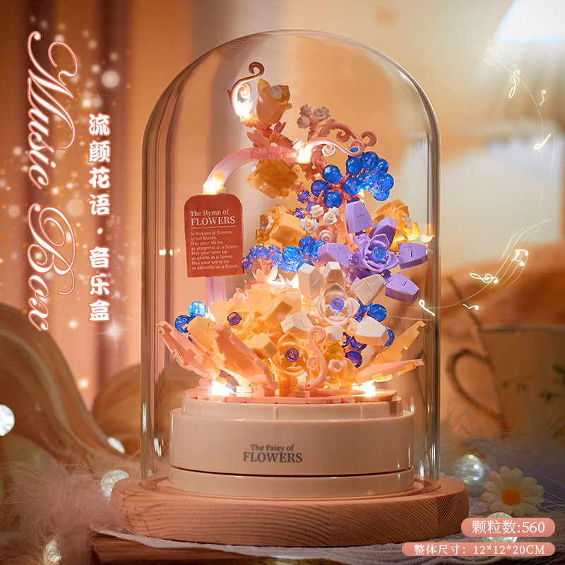 積み木の花がバラのオルゴールを飾っています。|undefined
