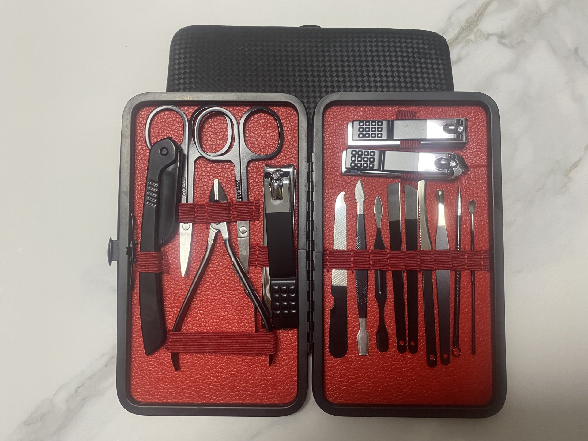 Nuevo juego de cortaúñas semi-negras de gama alta transfronterizo alemán juego completo de 7-24 piezas de herramientas de uñas de acero inoxidable en stock