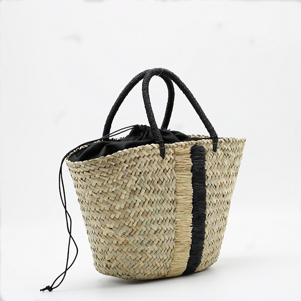 handheld straw blue black woven aquatic plants