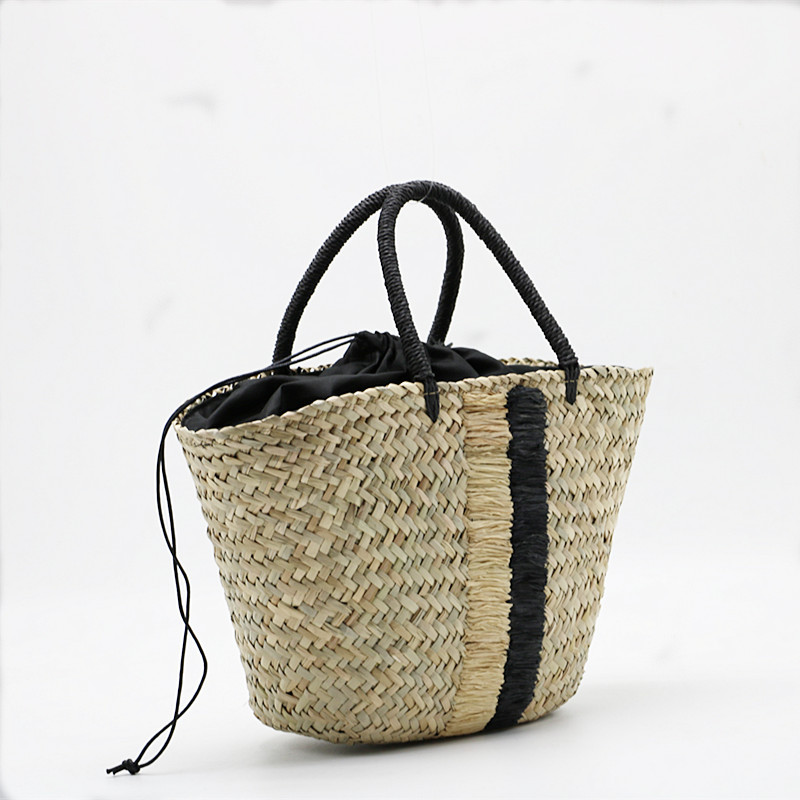 handheld straw blue black woven aquatic plants