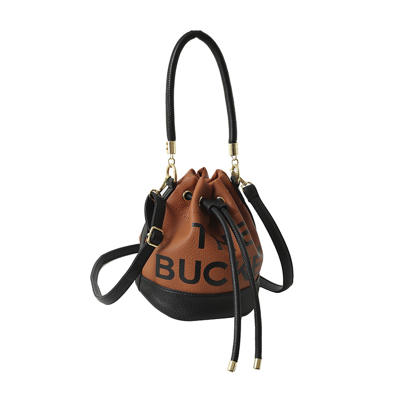 Bolso de hombro femenino casual todo-fósforo diseño de nicho sentido contraste color costuras cubo bolso de mano moda tendencia bandolera