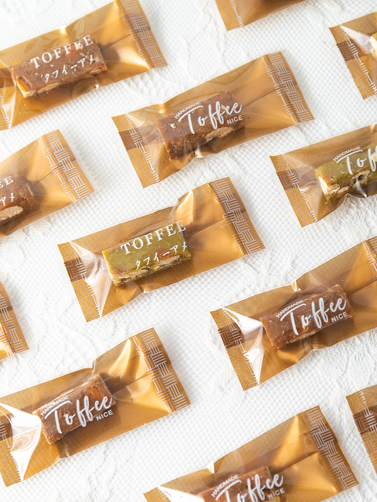 Bolsa de toffee de almendras de sal de mar gruesa independiente Tauragnut único caramelo de café sellado de máquina Año Nuevo 2025