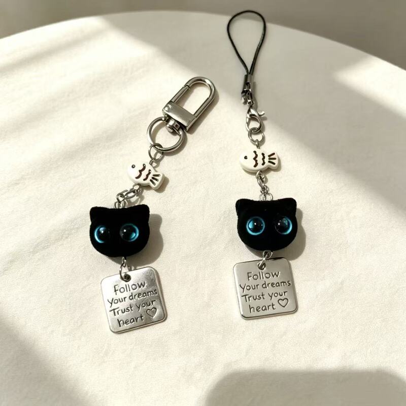 Black cat loves to eat fish, flocked big-eyed black cat keychain, cartoon phone strap, cute little black cat pendant accessory Black cat loves to eat fish, flocked big-eyed black cat keychain, cartoon phone strap, cute little black cat pendant accessory