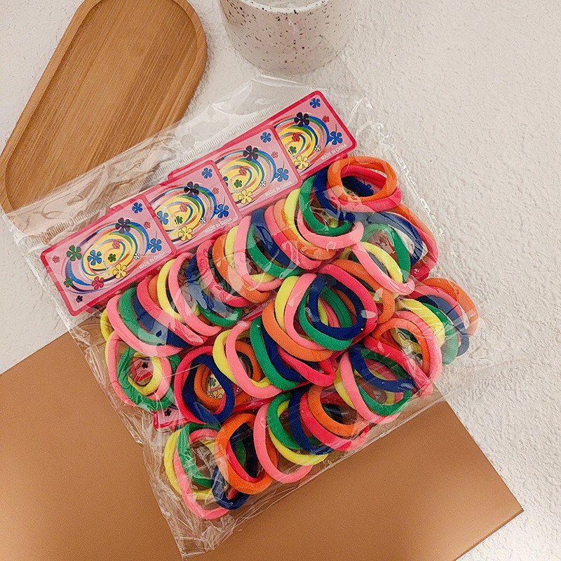 100-pieza de alta elástica sin costura toalla anillo de color Banda de pelo cuerda de pelo de color caramelo banda de goma cubierta de cuero cuerda de pelo al por mayor