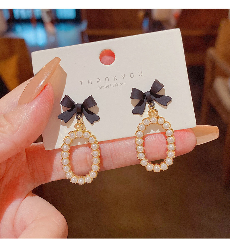 New Fashion Bow Inlaid Pearl Alloy Drop Earrings display picture 6