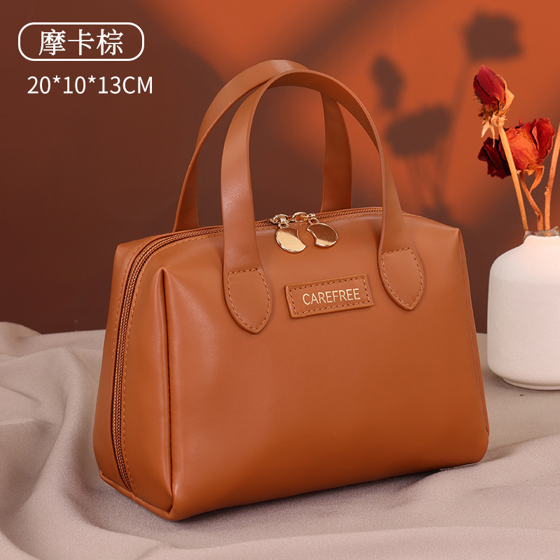 Luz de lujo francés pequeño bolso de maquillaje portátil multifuncional de alta calidad sensación de viaje bolsa de maquillaje portátil de mujer