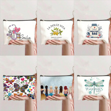 跨境热销印花卡通字母化妆包女式手拿包学生大容量笔袋帆布平板包