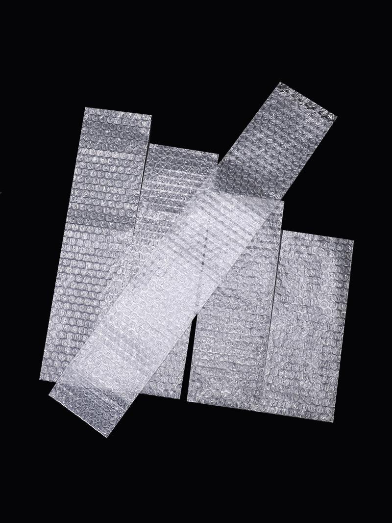 Bolsa de burbujas de tira larga grosada a prueba de choque tamaño pequeño personalizado bolsa de burbujas al por mayor expreso espuma de película de burbujas a prueba de choque