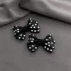 With bow, black