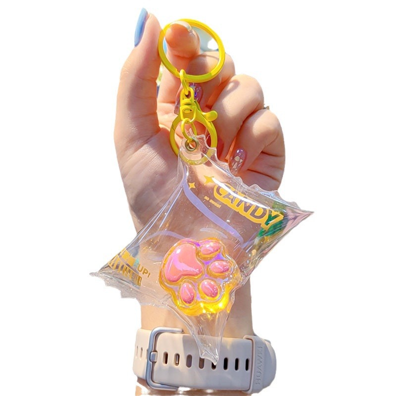Caramelos de color translucentes llaves de garra de gato bolsos de automóviles llaves colgantes delicados colgantes de garra de gato llaves al por mayor
