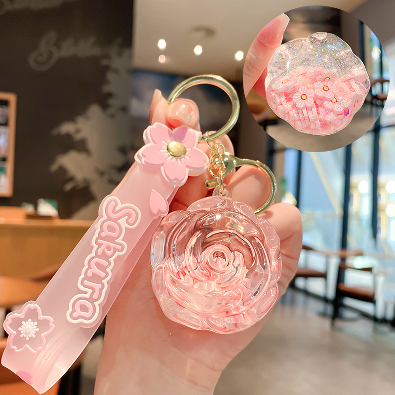 Llavero de rosa de aceite creativo lindo líquido arenas movedizas colgantes pequeños bolsos accesorios pareja pequeños regalos al por mayor