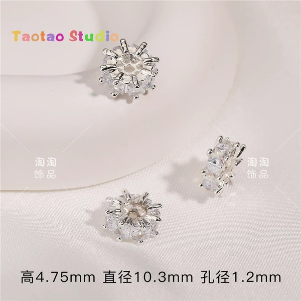One silver tasseled zircon spacer