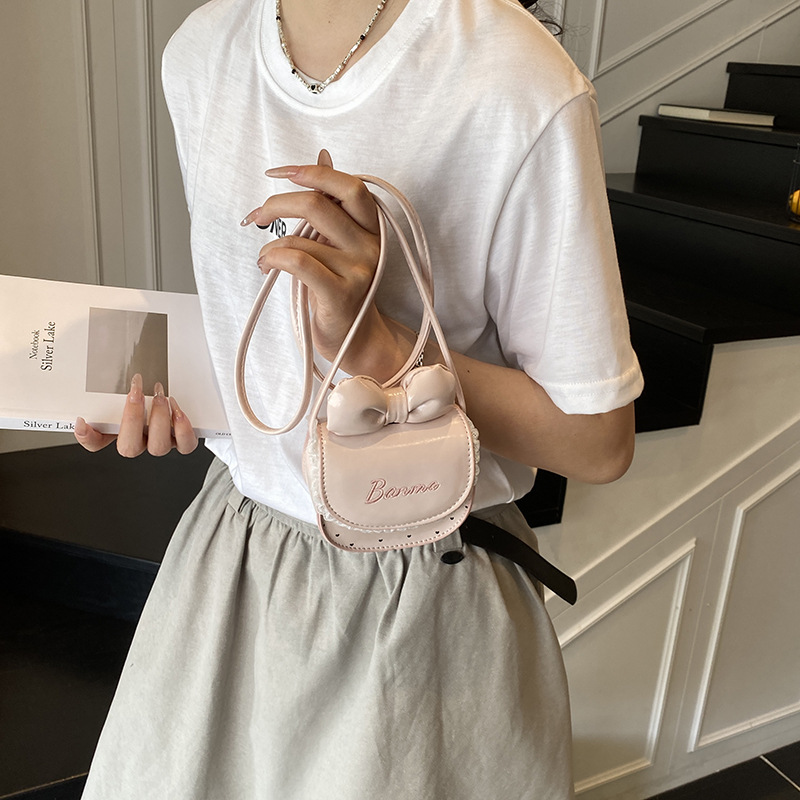 Nuevos accesorios para niños dulces lindos bolsos de hombro princesa arco ondulado punto de micro bolso de bebé