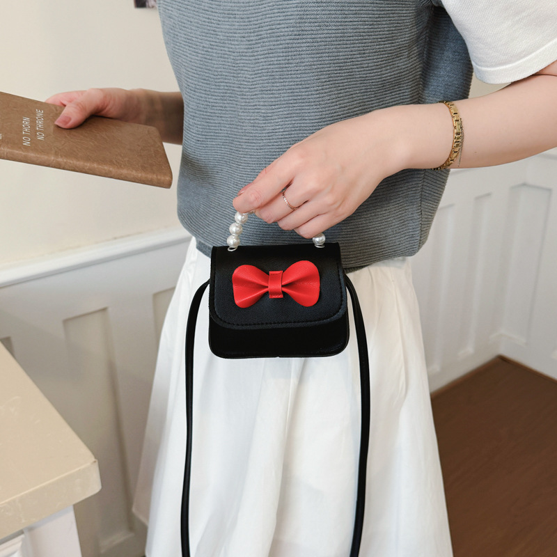 Bolsos para niños arco extranjero mini lindos bebés mochilas bolsos de perlas dulces bolsos de hombro para padres e hijos