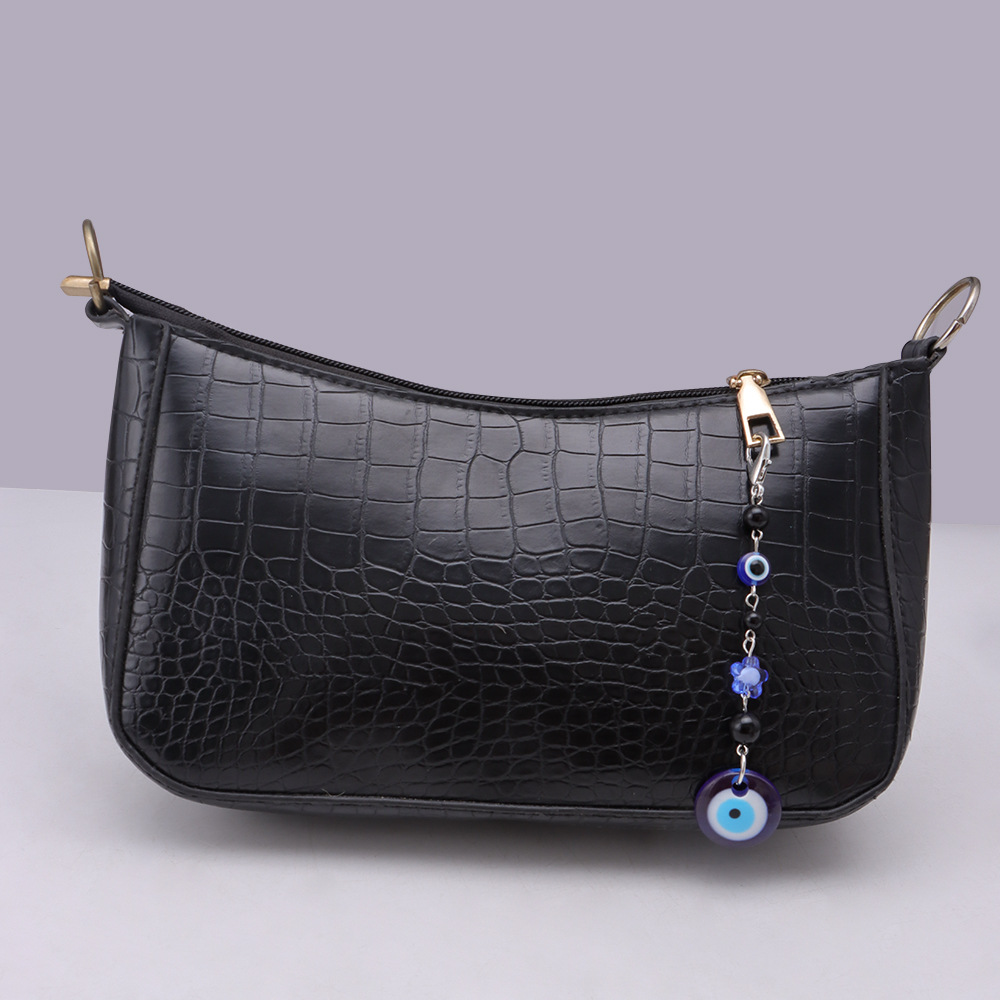 La versión coreana transfronteriza de la joyería de llavero de setas de color, la resina de dibujos animados, el ojo creativo del diablo, el bolso, el colgante de accesorios