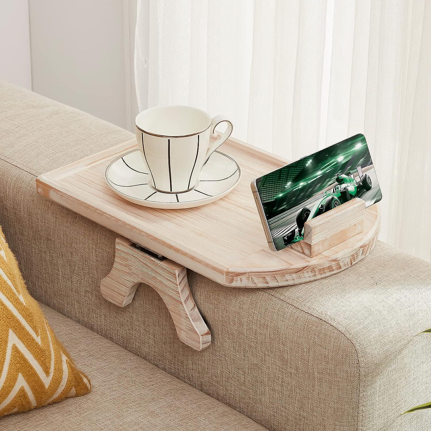 Sofa arm tray with phone holder clipped to sofa arm side tray table