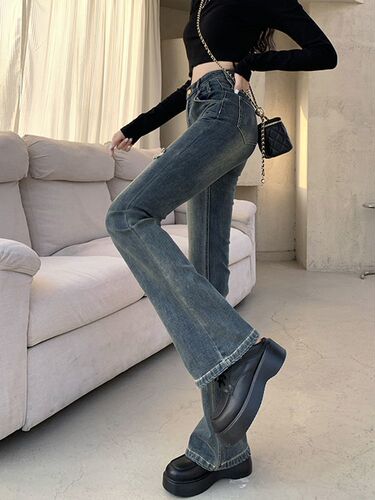 Fashionable high street hot girl micro-trumpet jeans women's spring and autumn new style broken hole design high waist slimming all-matching horseshoe pants