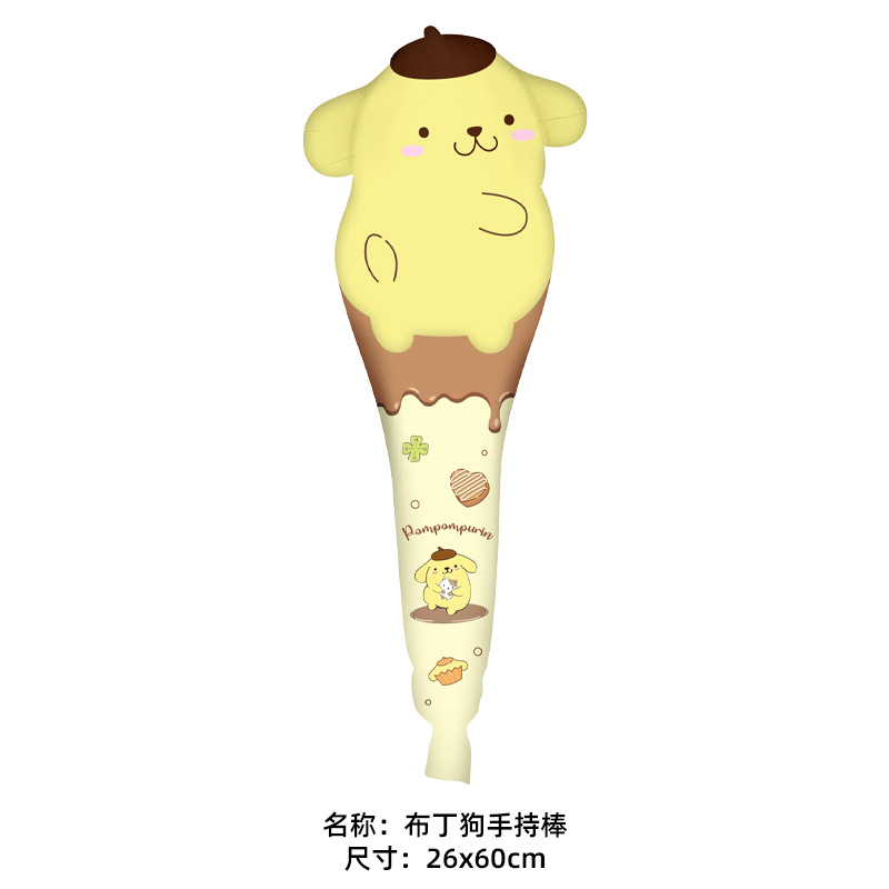 Pudding dog holding a stick