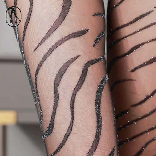 Sheer black fishnet stockings with leopard and zebra patterns