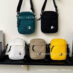 2025 新しいカジュアルクロスボディバッグトレンディな外出ファッションシングルショルダー小さな正方形バッグ男性と女性のアウトドアスポーツ携帯電話バッグ