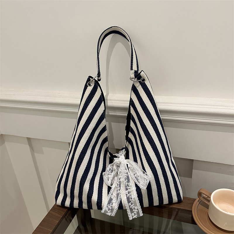 Bolsa de lona a rayas para mujeres verano 2024 nueva moda nicho coreano bolso especial bolso de tela de gran capacidad para estudiantes