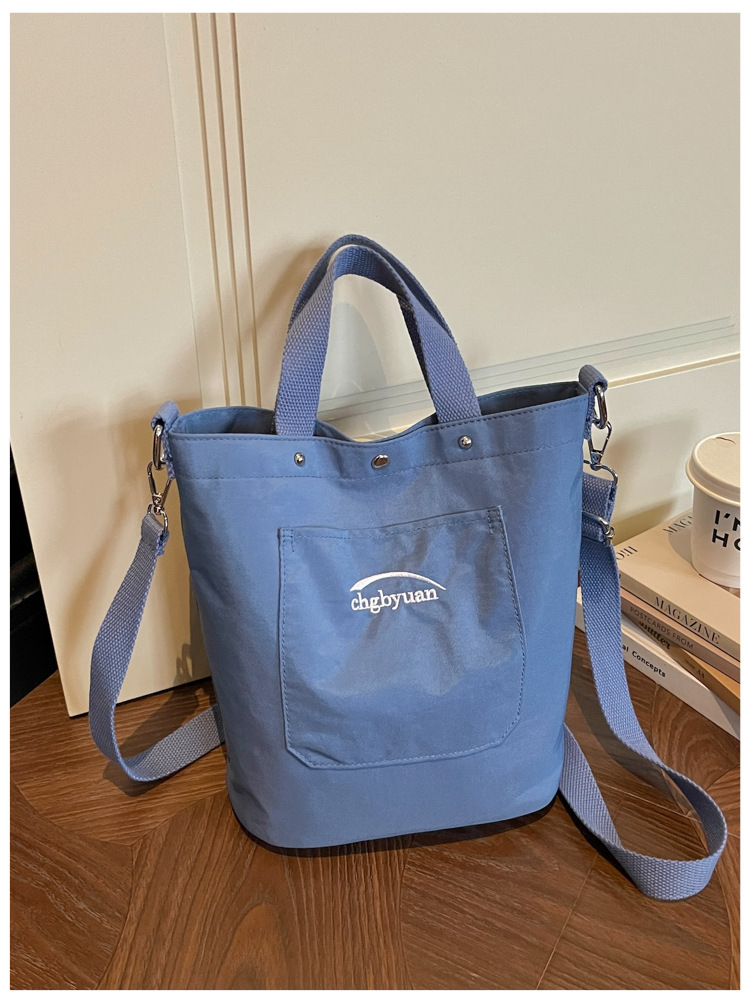 Bolso de mano de gran capacidad para mujeres 2026 verano nuevo estilo coreano simple mochila de hombro de viaje bolsa de ocio