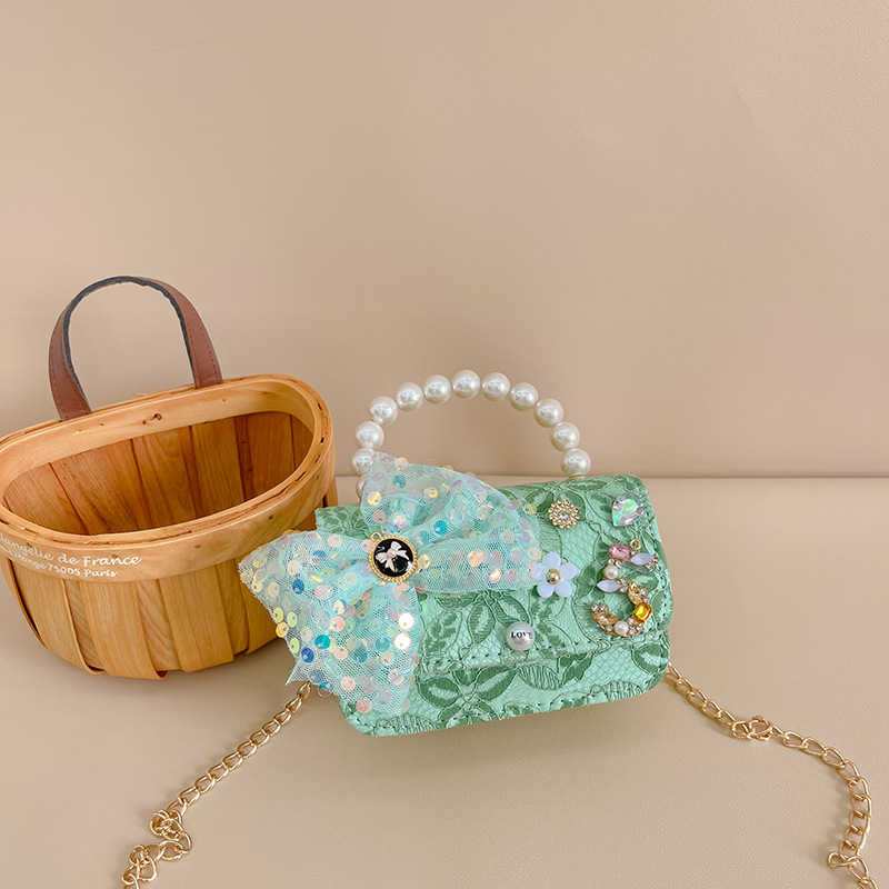 Primavera y verano nueva celebridad en línea bolso de los niños moda Chanel estilo princesa bolsa pequeña niña linda bolsa de mensajero portátil al por mayor